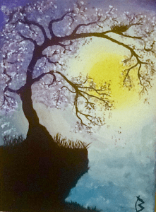 Blossom tree on a cliff hugging the sun.